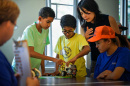 Karen Jin and Brianna Smith lead students through a robotics activity 