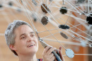 anna hepler installing sculpture at paul college