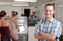 Customers line up to buy fresh fish at the Yankee Fisherman’s Cooperative’s new retail store in Seabrook, N.H. Charlie French, UNH Cooperative Extension associate professor, helped with the Coop’s marketing strategies.