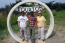 students at equator sign