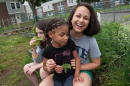 sarah garstka with kids in garden