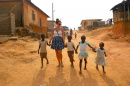 in Ghana, holding children's hands