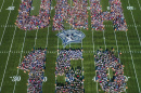 an aerial photo of UNH faculty, staff and students spelling out UNH 150 at Wildcat Stadium