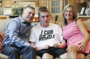 Brian Long, left, and Kim Long, right, with their son Brennan Long last year. Brennan was left with two shattered thigh bones after being restrained by a staff member in his Louisville school in 2014. —Sam Upshaw Jr./Louisville Courier-Journal-File