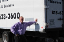 Mover Bob Christensen of Loves Park, Illinois, beside one of his trucks.
