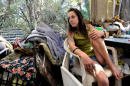 Billie Jo leans back at her homeless encampment on Bureau of Land Management land near unincorporated Cameron Park in El Dorado County, CA
