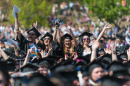 UNH students cheer at commencement. 