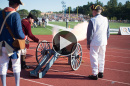 UNH alumnus Dick Dewing '53 firing the cannon at UNH's homecoming football game