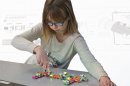 a young girl playing with LittleBits at East Rochester School