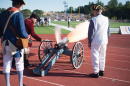 UNH alumnus Dick Dewing ’53 and assistants shoot off the cannon at a UNH football game