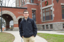 UNH student Jack Hamilton '20 in front of Thompson Hall on the Durham campus