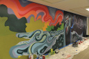 a mural in progress at UNH's Dimond Library, celebrating its sesquicentennial