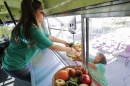 A student studying business and his wife studying social work teamed up on a plan to retrofit buses as mobile markets to bring nutritious offerings to "food deserts." (EPA/Newscom)