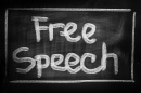 A sign that reads "Free Speech"