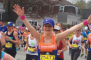 UNH student and runner Katie Litwinowich Meinelt ’03, ’04G crossing the finish line at the Boston Marathon
