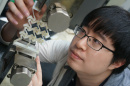 Yunyao Jiang, a doctoral candidate in mechanical engineering at UNH, using a 3D-printed prototype to prove concept of sequential cell-opening mechanism.