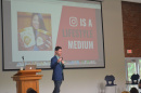 A speaker presents at the 2018 Paul College Digital Marketing Symposium