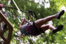 a UNH Cooperative Extension 4-H member using a zipline at Candia Springs