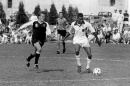 Two college soccer players in a black and white photo from the 1990s