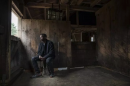 Abdi Nor Iftin, a Somali refugee, in the Maine barn where he cared for horses and chopped wood (Greta Rybus for The Boston Globe)