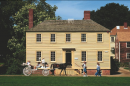 A carriage goes by the Lowd House in Strawbery Bank in Portsmouth, NH