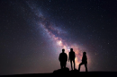 people looking at the night sky