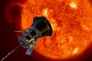 A silver octagonal probe approaches the red-hot surface of the sun.