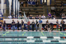 Middle school students driving robots at University of New Hampshire pool during SeaPerch event