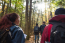 UNH students walking in the woods