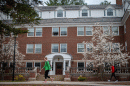 Students walking by UNH's Scott Hall