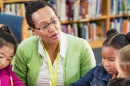 A teacher speaking with elementary school students