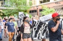 Tamara Marcus holding a banner during protest march  