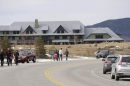 Walkers make their way to their cars parked along the road in Crawford Notch