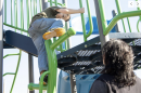 Mom watches her son play on the playground in New Hampshire