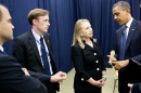 Jake Sullivan stands with former President Barak Obama and former Secretary of State Hillary Clinton