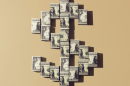 Image of a U.S. currency symbol made from folded up dollars.