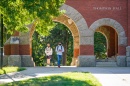 Students walking through T Hall arch