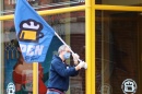 A Portsmouth store owner puts out an open for business sign