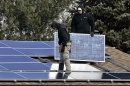 Image of man installing solar panels 