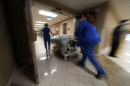 A photo showing emergency room workers helping a person.