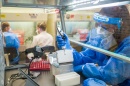 Technician testing samples in a lab.