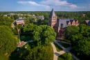 Aerial shot of UNH campus in summer, with T Hall in center