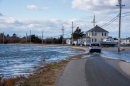 Car driving through flooded street