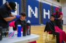 Students getting haircuts in Lundholm Gym