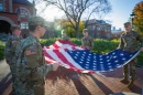 UNH ROTC students holding American flag