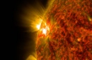 Solar flare bursts away from the surface of the sun.