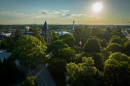 aerial photo of sun setting over T Hall