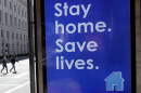 Image with sign staying Stay Home. Save Lives.