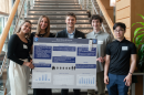 Paul College students present their research poster exploring whether paying high rent prices impacts academic success.