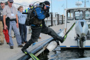 deep sea diver jumps into water 